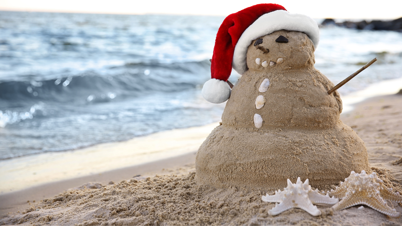 Warm weather beach destination with clear blue water, perfect for escaping winter travel